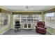 Bright office with large windows, ceiling fan, and comfortable seating at 767 Barbados Pl, The Villages, FL 32162