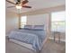Primary bedroom with large windows and stylish side tables at 769 Daybreak Pl, Longwood, FL 32750