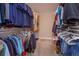 Walk-in closet with ample hanging space on both sides, providing an abundance of storage at 769 Daybreak Pl, Longwood, FL 32750