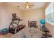 Exercise room features fitness equipment, a ceiling fan, and a window for natural light at 769 Daybreak Pl, Longwood, FL 32750