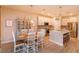 Open-concept kitchen and dining area with pendant lights and stainless steel appliances at 769 Daybreak Pl, Longwood, FL 32750