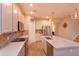 Modern kitchen featuring a large center island, stainless steel appliances, and white cabinetry at 769 Daybreak Pl, Longwood, FL 32750