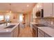 Modern kitchen featuring a large center island, stainless steel appliances, and white cabinetry at 769 Daybreak Pl, Longwood, FL 32750