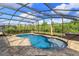 Stunning screened pool featuring unique shape, fountain, and relaxing sun-shelf with beautiful tiling at 769 Daybreak Pl, Longwood, FL 32750