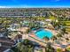 Aerial view of the community pool with cabanas and beach volleyball court at 9018 Stinger Dr, Davenport, FL 33896