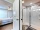 Bathroom with a glass shower is visible from the bedroom at 9018 Stinger Dr, Davenport, FL 33896