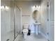Bright bathroom featuring white fixtures, a glass-enclosed shower, and modern lighting at 9018 Stinger Dr, Davenport, FL 33896