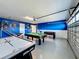 Game room area with an air hockey, pool, and foosball table at 9018 Stinger Dr, Davenport, FL 33896