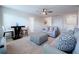 A well-lit living room with comfortable seating and a decorative ottoman, perfect for relaxation at 9018 Stinger Dr, Davenport, FL 33896