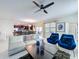 Open-concept living space with comfortable seating, modern decor, and lots of natural light at 9018 Stinger Dr, Davenport, FL 33896