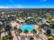 A beautiful aerial view of a community pool complete with palm trees and lounge chairs at 9018 Stinger Dr, Davenport, FL 33896
