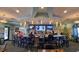 Spacious restaurant area featuring an open bar and festive holiday decorations at 9018 Stinger Dr, Davenport, FL 33896