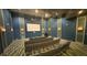 Modern theater room complete with comfortable seating and large screen for immersive entertainment at 9018 Stinger Dr, Davenport, FL 33896