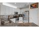 A well-equipped kitchen with white cabinets, a tiled backsplash, and stainless steel appliances at 9089 Saint Andrews Way, Mount Dora, FL 32757