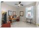 An office space with a desk, chair, and plenty of natural light from the window at 9089 Saint Andrews Way, Mount Dora, FL 32757
