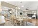 Open concept dining area that is connected to the living room and kitchen with lots of natural light at 973 Baisley Trl, The Villages, FL 32162