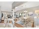 Bright and airy open concept dining area with views of the living room and lots of natural light at 973 Baisley Trl, The Villages, FL 32162