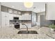Kitchen featuring stainless steel appliances, granite countertops, and white cabinetry at 973 Baisley Trl, The Villages, FL 32162