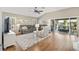 Inviting living area with hardwood floors, natural light, ample seating, and access to the patio at 973 Baisley Trl, The Villages, FL 32162