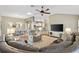 Bright and open living space with a view of the dining and kitchen area at 973 Baisley Trl, The Villages, FL 32162