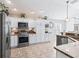 Kitchen featuring stainless appliances, granite countertops, and ample counter space at 10069 Lake Miona Way, Oxford, FL 34484