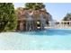 Gorgeous pool with waterfall feature and a relaxing atmosphere for hot summer days at 10069 Lake Miona Way, Oxford, FL 34484