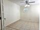 Bright room featuring tile floors, natural light, and ceiling fan at 104 N Oakland Ave, Clermont, FL 34715