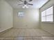 Bright room featuring tile floors, natural light, and ceiling fan at 104 N Oakland Ave, Clermont, FL 34715