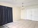Dining area featuring tile floors, decorative chandelier, and closet space at 104 N Oakland Ave, Clermont, FL 34715