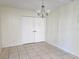 Bright dining area featuring tile floors, a closet, neutral walls, and modern lighting at 104 N Oakland Ave, Clermont, FL 34715