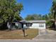 Charming single-story home featuring a well-maintained lawn and a classic mailbox at 104 N Oakland Ave, Clermont, FL 34715