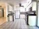 Stylish kitchen featuring modern stainless steel appliances and patterned flooring at 104 N Oakland Ave, Clermont, FL 34715