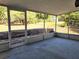 Screened porch with a view of the backyard at 104 N Oakland Ave, Clermont, FL 34715
