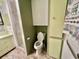 Bathroom featuring toilet, tiled floor, and shower at 104 Valencia Cv, Leesburg, FL 34748
