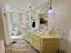 Bathroom with soaking tub, double sinks, and tile floors at 104 Valencia Cv, Leesburg, FL 34748