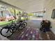 Covered carport area with ample space for parking and storage or additional space for entertaining guests at 104 Valencia Cv, Leesburg, FL 34748