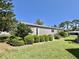 Lovely home featuring well-kept landscaping and a charming, well-maintained exterior at 104 Valencia Cv, Leesburg, FL 34748