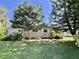 Attractive home with a manicured lawn, mature trees, and well-placed shrubbery at 104 Valencia Cv, Leesburg, FL 34748