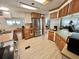 Bright kitchen featuring stainless steel appliances, stylish countertops, and neutral flooring at 104 Valencia Cv, Leesburg, FL 34748