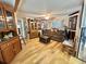 Inviting living room featuring beautiful hardwood floors and ample storage at 104 Valencia Cv, Leesburg, FL 34748