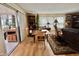 Bright living room with hardwood floors and sliding doors leading to an outdoor area at 104 Valencia Cv, Leesburg, FL 34748