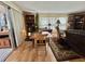 Bright living room with hardwood floors and sliding doors leading to an outdoor area at 104 Valencia Cv, Leesburg, FL 34748