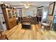 Comfortable living room with hardwood floors, plenty of light, and built in display cabinets at 104 Valencia Cv, Leesburg, FL 34748