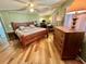 Main bedroom featuring wood floor at 104 Valencia Cv, Leesburg, FL 34748