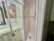 Bathroom featuring shower and tile surround at 104 Valencia Cv, Leesburg, FL 34748