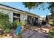 Well-maintained backyard with patio, seating, and lush landscaping at 106 Baytree Blvd, Tavares, FL 32778