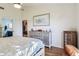 Bright bedroom with wood flooring, ensuite bathroom, and large dresser at 106 Baytree Blvd, Tavares, FL 32778