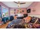 Comfortable bedroom with desk and colorful decorations at 106 Baytree Blvd, Tavares, FL 32778