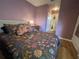 Bedroom featuring a comfortable bed, hardwood floors, and a closet offering ample storage space at 106 Baytree Blvd, Tavares, FL 32778