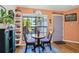 Charming breakfast nook with a cozy table, bright window, and stylish decor at 106 Baytree Blvd, Tavares, FL 32778